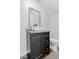 Modern bathroom vanity with vessel sink and dark wood cabinet at 57 E South St, Mooresville, IN 46158