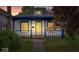 Charming home featuring a cozy front porch with classic blue columns and a well-manicured lawn at 57 E South St, Mooresville, IN 46158