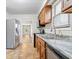 Functional kitchen featuring wood cabinets, tile floors, stainless steel appliances, and neutral walls at 57 E South St, Mooresville, IN 46158