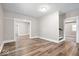 Open concept living room featuring hardwood floors, neutral walls, and open doorways to other rooms at 57 E South St, Mooresville, IN 46158