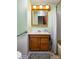 Bathroom with a wooden vanity, medicine cabinet, and tub shower combo at 5749 Teresa Dr, Alexandria, IN 46001