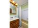 This bathroom features a wooden vanity with an integrated sink, a large mirror and tub shower combo at 5749 Teresa Dr, Alexandria, IN 46001