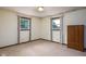 Empty bedroom with two windows and a wooden wardrobe at 5749 Teresa Dr, Alexandria, IN 46001