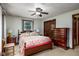 Inviting bedroom with a ceiling fan, dresser, carpeted floor, and charming decor creating a relaxing space at 5749 Teresa Dr, Alexandria, IN 46001