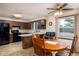 Eat-in kitchen with wooden cabinets, black appliances, peninsula, and an eat-in table at 5749 Teresa Dr, Alexandria, IN 46001