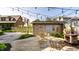 Backyard featuring an outdoor fireplace, garden, and lounge seating beneath ambient market lighting at 5760 Central N Ave, Indianapolis, IN 46220