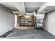 Unfinished basement with exposed ductwork, concrete floor, and wooden shelving for ample storage at 5760 Central N Ave, Indianapolis, IN 46220