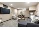 Finished basement with a seating area, dining table, and neutral decor at 5760 Central N Ave, Indianapolis, IN 46220