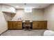 Finished basement featuring built-in cabinets and desk space, offering versatile storage and workspace options at 5760 Central N Ave, Indianapolis, IN 46220