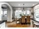 Dining room featuring a chandelier, table, wicker chairs, and natural light at 5760 Central N Ave, Indianapolis, IN 46220