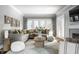 Inviting living room featuring a large sectional sofa, fireplace, and neutral decor at 5760 Central N Ave, Indianapolis, IN 46220