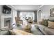 Cozy living room featuring a fireplace, comfortable seating, and neutral decor at 5760 Central N Ave, Indianapolis, IN 46220