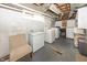 Unfinished basement with a laundry area including a washer, dryer, and utility sink at 5829 Indianola Ave, Indianapolis, IN 46220