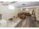 Finished basement with a brown sectional sofa and play area for versatile living space at 5829 Indianola Ave, Indianapolis, IN 46220