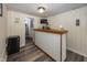 Finished basement with a bar area and a small television for entertainment and relaxation at 5829 Indianola Ave, Indianapolis, IN 46220
