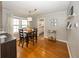 Bright dining room with wood floors and stylish furnishings at 5829 Indianola Ave, Indianapolis, IN 46220