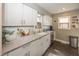 Well-lit kitchen with modern cabinets and sleek countertops at 5829 Indianola Ave, Indianapolis, IN 46220