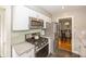 Efficient kitchen layout with stainless steel appliances and modern finishes at 5829 Indianola Ave, Indianapolis, IN 46220