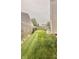 The backyard includes a neatly kept lawn, a wood fence, and pathway lighting at 5924 Sable Dr, Indianapolis, IN 46221
