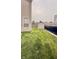 Side yard has a wood fence and gravel path with lighting leading to a storage shed at 5924 Sable Dr, Indianapolis, IN 46221
