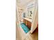 Well-lit bathroom features double sinks, wood vanity, and cute palm tree decor throughout at 5924 Sable Dr, Indianapolis, IN 46221