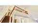 Hallway landing with staircase, wooden banister, and natural light, creating a warm and inviting atmosphere at 5924 Sable Dr, Indianapolis, IN 46221