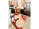 Efficient kitchen with stainless steel appliances, wooden cabinets, and ample counter space, perfect for cooking at 5924 Sable Dr, Indianapolis, IN 46221