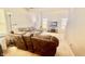 Cozy living room with neutral carpet, comfortable sofas, and ample natural light from windows, ideal for relaxing at 5924 Sable Dr, Indianapolis, IN 46221