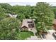 Aerial view of home with lush green lawn, mature trees, and outdoor entertaining area at 5946 Guilford Ave, Indianapolis, IN 46220