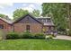 Charming brick home with manicured lawn and patio area for outdoor entertaining at 5946 Guilford Ave, Indianapolis, IN 46220
