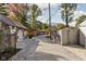 Scenic backyard garages and flower mural with stone pathway and gravel in a residential area at 5946 Guilford Ave, Indianapolis, IN 46220