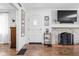 Inviting entryway with stone fireplace, white painted walls, hardwood floors and stylish decor at 5946 Guilford Ave, Indianapolis, IN 46220