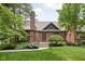 Beautiful brick home with a well-manicured lawn, mature trees, and excellent curb appeal at 5946 Guilford Ave, Indianapolis, IN 46220