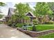 Beautiful brick home with a stone retaining wall and manicured greenery at 5946 Guilford Ave, Indianapolis, IN 46220