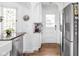 Kitchen with stainless steel appliances, a farmhouse sink, and stained glass window near the door and refrigerator at 5946 Guilford Ave, Indianapolis, IN 46220