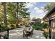 Spacious outdoor patio with a dining table, lush landscaping, and backyard views at 5946 Guilford Ave, Indianapolis, IN 46220