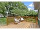 Charming back deck with stylish seating overlooking the lush backyard at 6107 Broadway St, Indianapolis, IN 46220