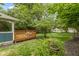 Spacious backyard with a well-maintained lawn and deck, ideal for outdoor activities at 6107 Broadway St, Indianapolis, IN 46220