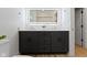 Modern bathroom vanity featuring an illuminated mirror and dual sinks at 6107 Broadway St, Indianapolis, IN 46220