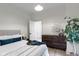 Bedroom with white walls, natural light and wood accents offers a soothing aesthetic at 6107 Broadway St, Indianapolis, IN 46220