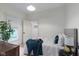 Comfortable bedroom has a large window with a backyard view and neutral tones at 6107 Broadway St, Indianapolis, IN 46220