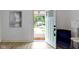Bright entryway with an open door, showcasing the transition to the home's interior at 6107 Broadway St, Indianapolis, IN 46220