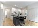 Modern kitchen with white cabinetry, a sleek black island, and contemporary finishes at 6107 Broadway St, Indianapolis, IN 46220