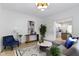 Well-lit living room boasting an open layout, modern decor, and comfortable furnishings at 6107 Broadway St, Indianapolis, IN 46220