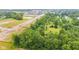 Overhead shot of property showcasing wooded areas, pond, and new construction nearby at 6575 E 171St St, Noblesville, IN 46062