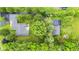 Aerial view of home with mature trees, a basketball court, patio, and garden at 6575 E 171St St, Noblesville, IN 46062