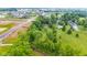 Aerial view of homes in a neighborhood with green lawns and mature trees at 6575 E 171St St, Noblesville, IN 46062
