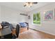 Bright bedroom with wood floors, a large window, and a ceiling fan at 6575 E 171St St, Noblesville, IN 46062