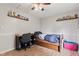 Comfortable bedroom with hardwood floors, built-in shelves, and plenty of natural light at 6575 E 171St St, Noblesville, IN 46062