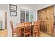 Cozy dining area with wooden table and chairs, complemented by a rustic sliding barn door at 6575 E 171St St, Noblesville, IN 46062